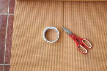 Yoga Mat, Scissors and Tape for childproofing DIY