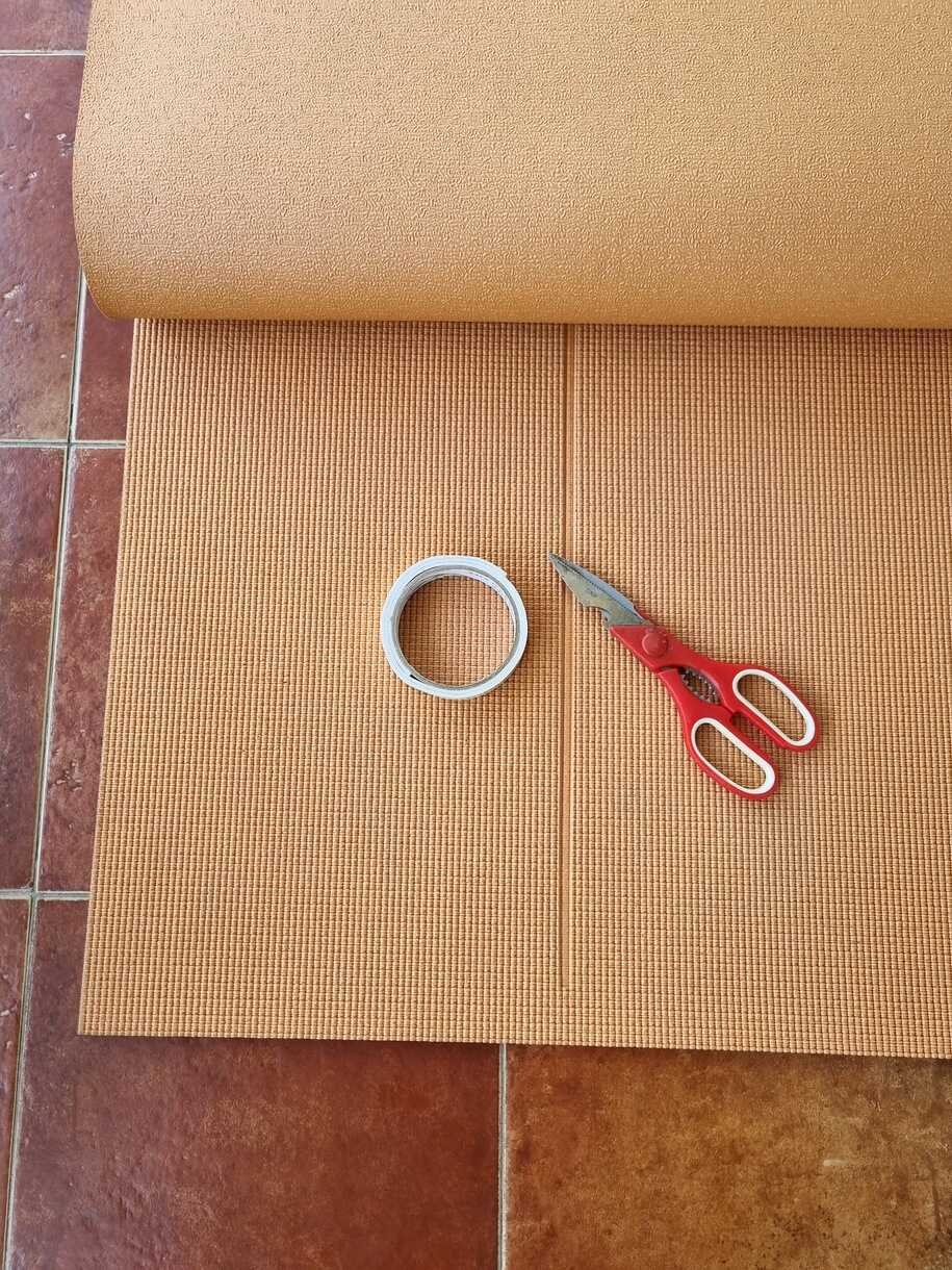 Yoga Mat, Scissors and Tape for childproofing DIY