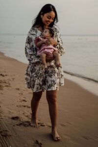 A mother and infant at the beach