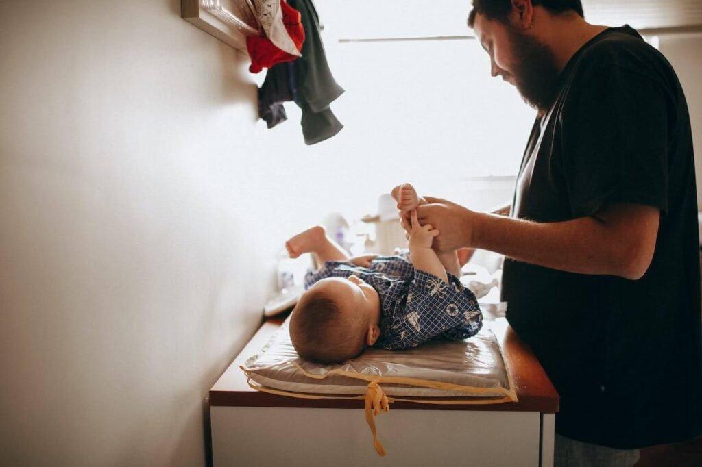 Dad infant bonding during diaper change